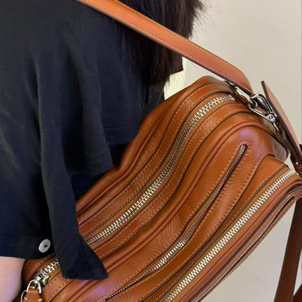 Black Vegan Leather Crescent Crossbody Bag – Adjustable Strap, Multiple Zipper Pockets, Sleek Silver Accents