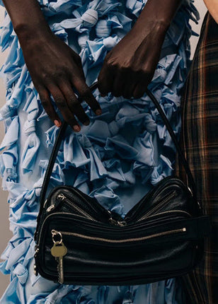 Black Vegan Leather Crescent Crossbody Bag – Adjustable Strap, Multiple Zipper Pockets, Sleek Silver Accents