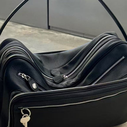 Black Vegan Leather Crescent Crossbody Bag – Adjustable Strap, Multiple Zipper Pockets, Sleek Silver Accents