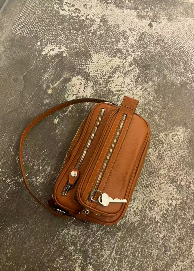 Black Vegan Leather Crescent Crossbody Bag – Adjustable Strap, Multiple Zipper Pockets, Sleek Silver Accents